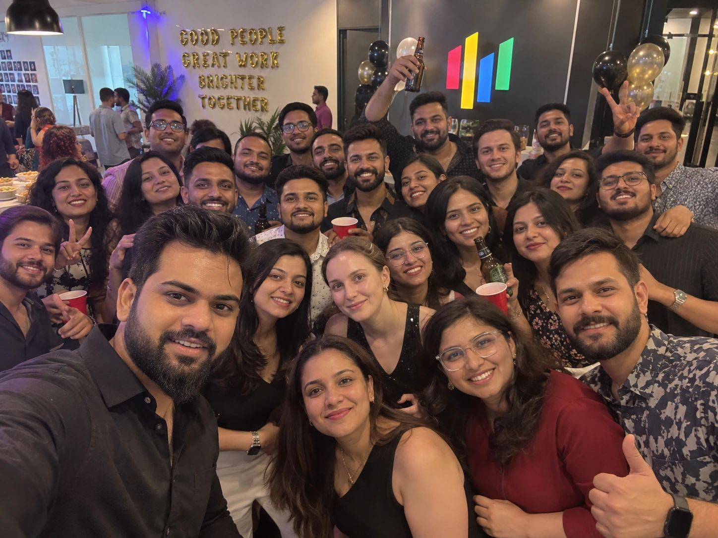 Analytix9 team sharing a moment at an office gathering